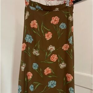 Brien with salmon color flower skirt.